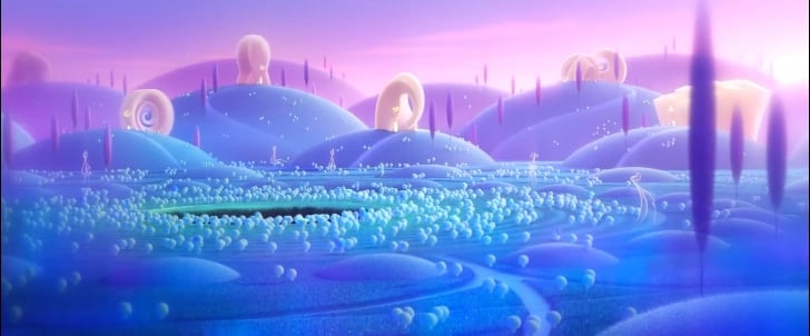 An animated landscape from Pixar’s Soul, depicting The Great Before. Rolling blue and purple hills are dotted with glowing golden portals and small, translucent figures representing souls. The sky is soft pink, casting a warm glow over the scene.